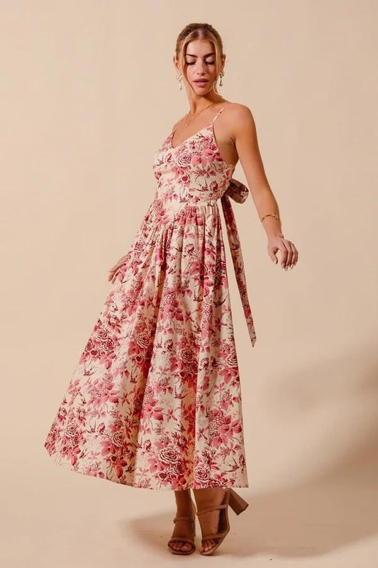 Back of the cottagecore cotton dress showing the adjustable tie-back bow and spaghetti straps