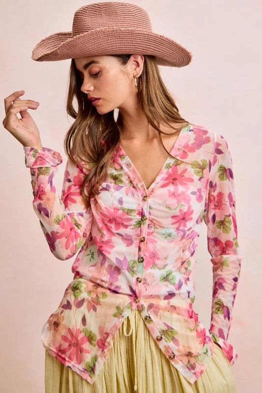 Ruched pink floral mesh V-neck blouse with a pointed hem and long sleeves in a fairycore botanical watercolor print.