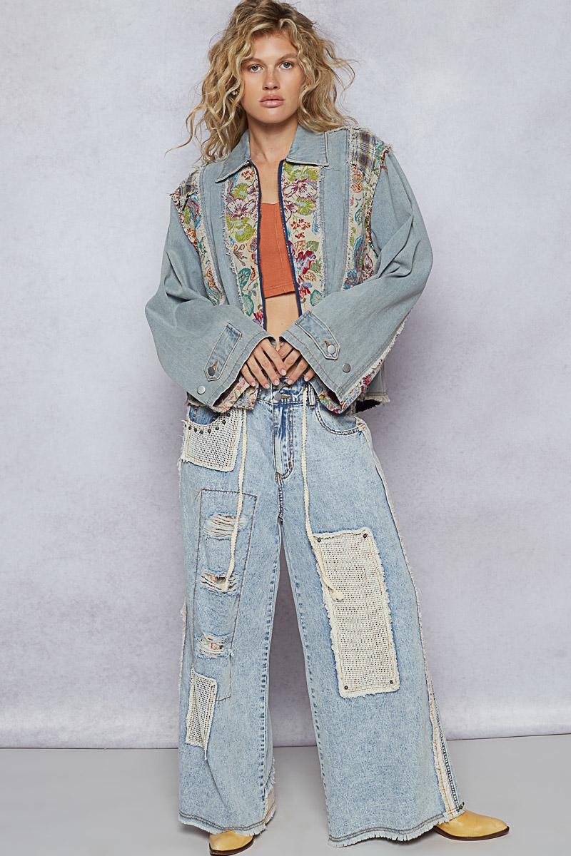 Full view of the patchwork floral denim jacket styled for a vintage-inspired, layered Boho-chic look