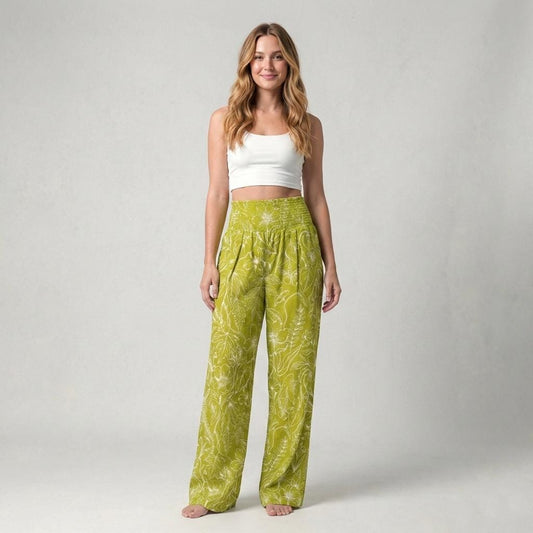 Lime green floral 100% linen wide leg pants with a smocked waistband in a tall fit, paired with a white crop top.