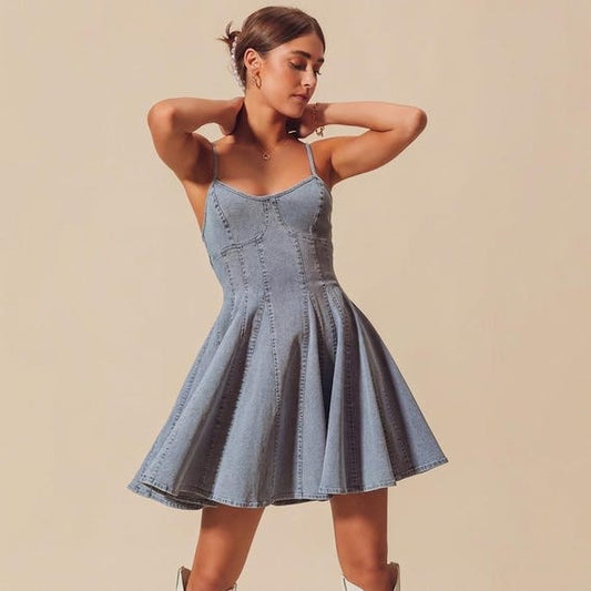 Front view of a light wash denim corset mini dress with a sweetheart neckline and spaghetti straps