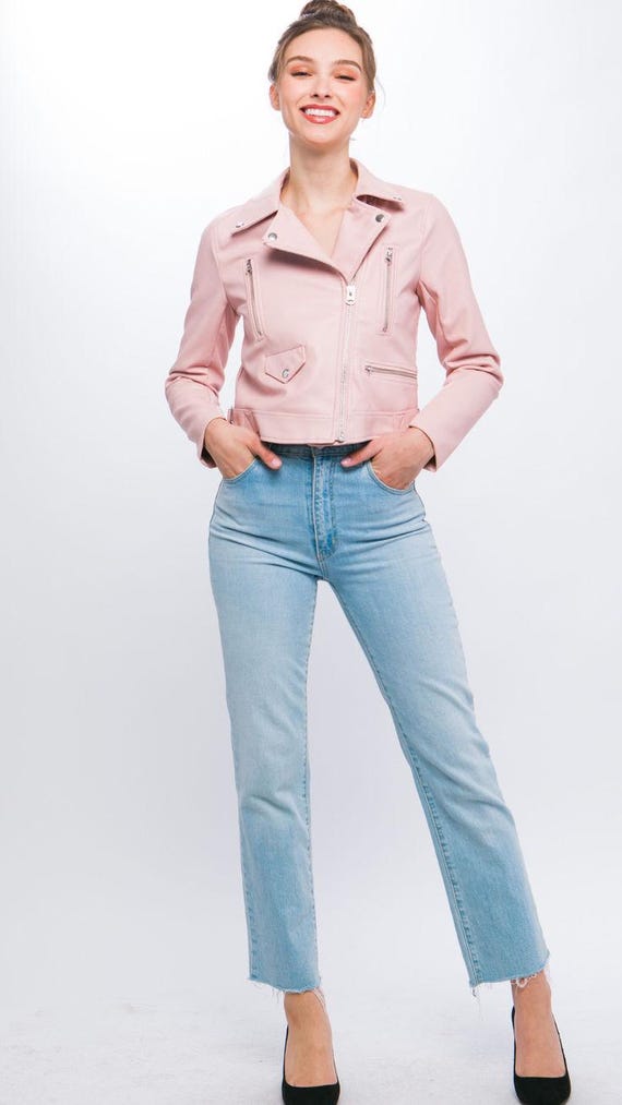Detail of women's pink biker jacket showing notched lapel and snap button closure