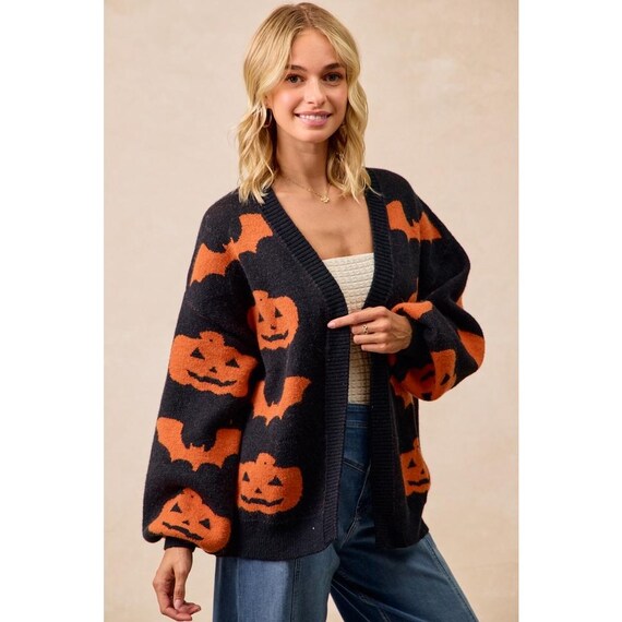 Cozy Whimsigoth black and orange pumpkin bat print cardigan with a relaxed open-front design.