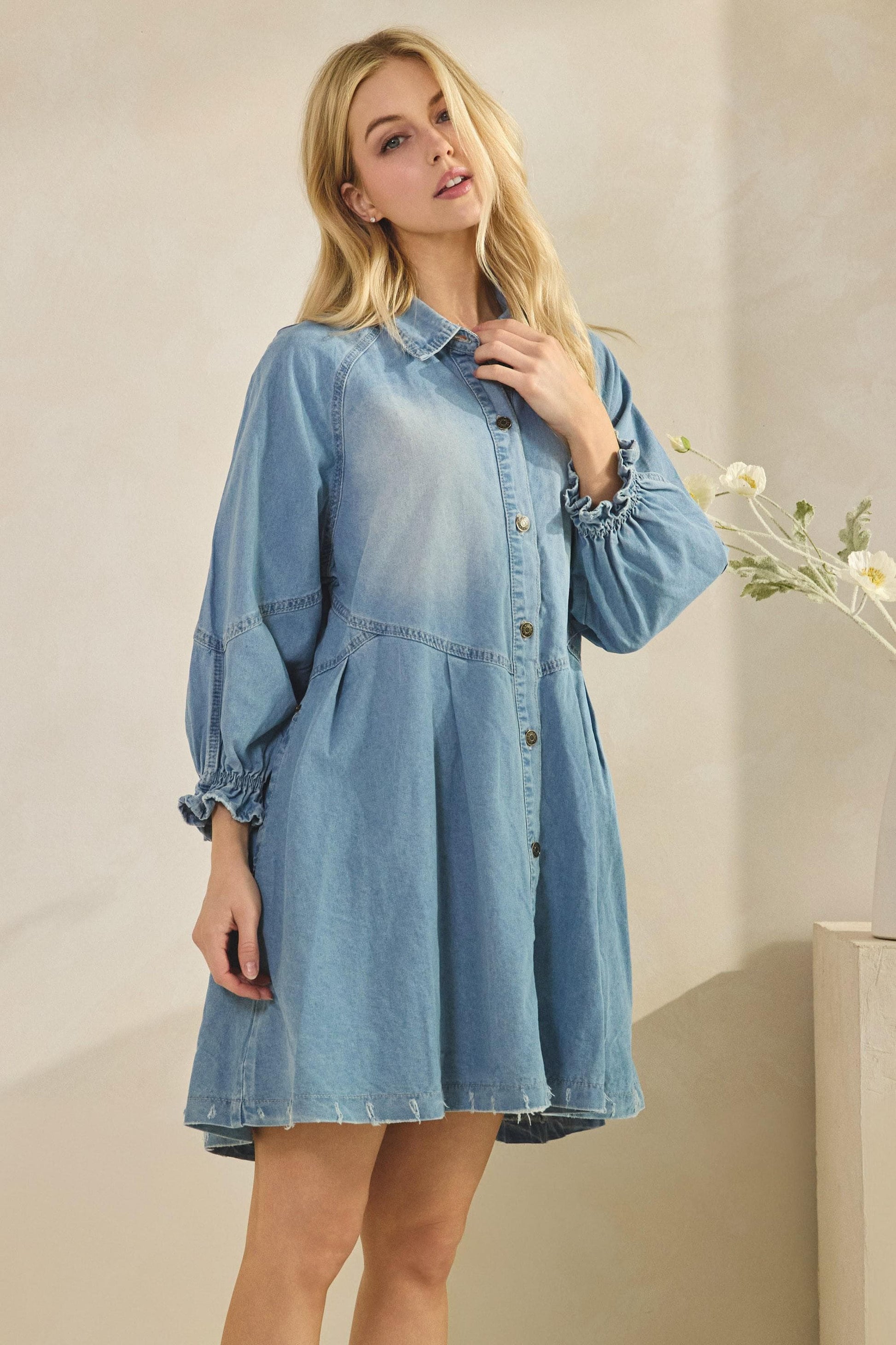 Detailed view of feminine gathered sleeves and structured collar on a western-inspired shirt dress