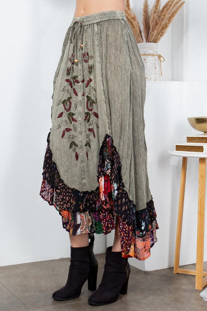 Model wearing the Cottagecore-style patchwork skirt paired with artisan accessories for a modern hippie look.