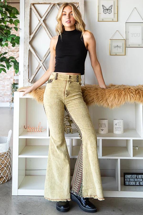 Side profile of high-waisted 70s retro flare pants highlighting the wide leg and Western-core aesthetic.