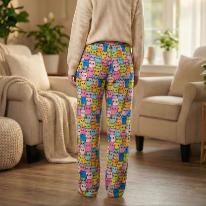 Detail of the high waisted elastic band on these multi-colored feline print fleece trousers.