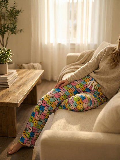 Lower leg view showing the long inseam on these expressive cat-themed fleece pajama bottoms.