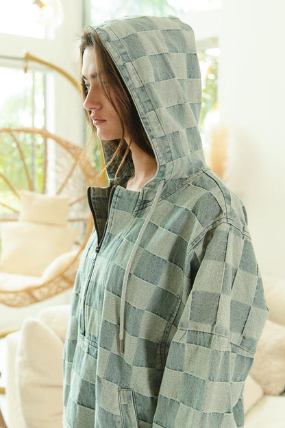 Close-up of the front kangaroo pocket on a soft-washed cotton blend denim hoodie in indie sleaze style.