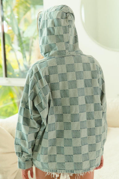 Flat lay of a vintage style checkered denim hoodie showcasing the muted blue and gray pattern and streetwear design.