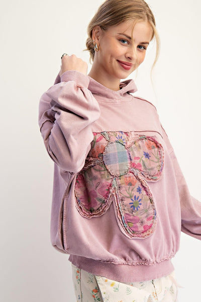 Mauve cotton floral patchwork hoodie with oversized fit and raw-edge applique on the chest.