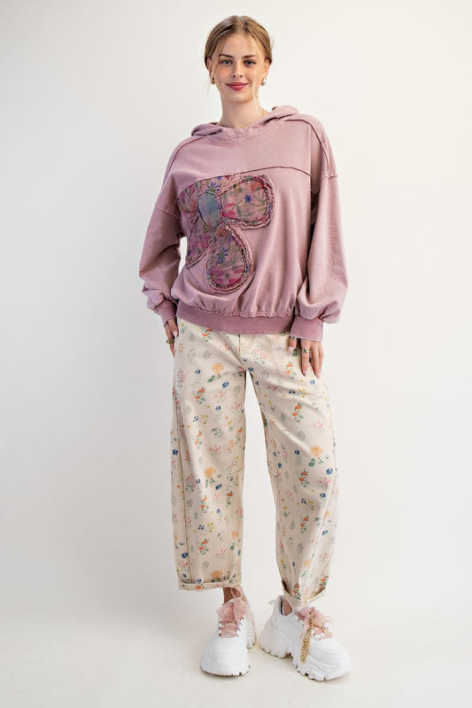 Back view of the oversized boho pullover in mauve cotton featuring a relaxed silhouette and dropped shoulders.