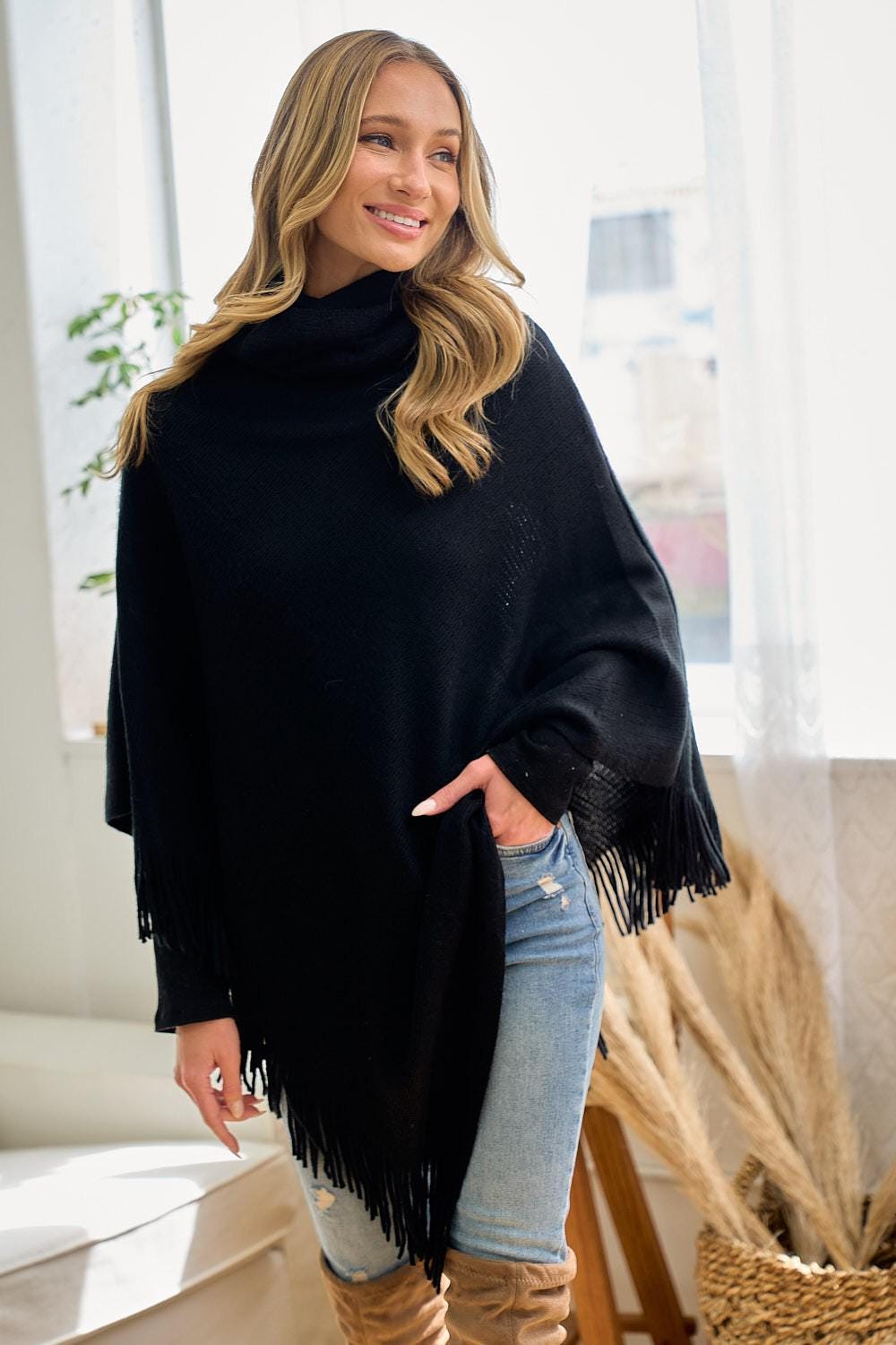 Full view of the oversized black knit wrap, an ideal layering piece for modern southwestern outfits