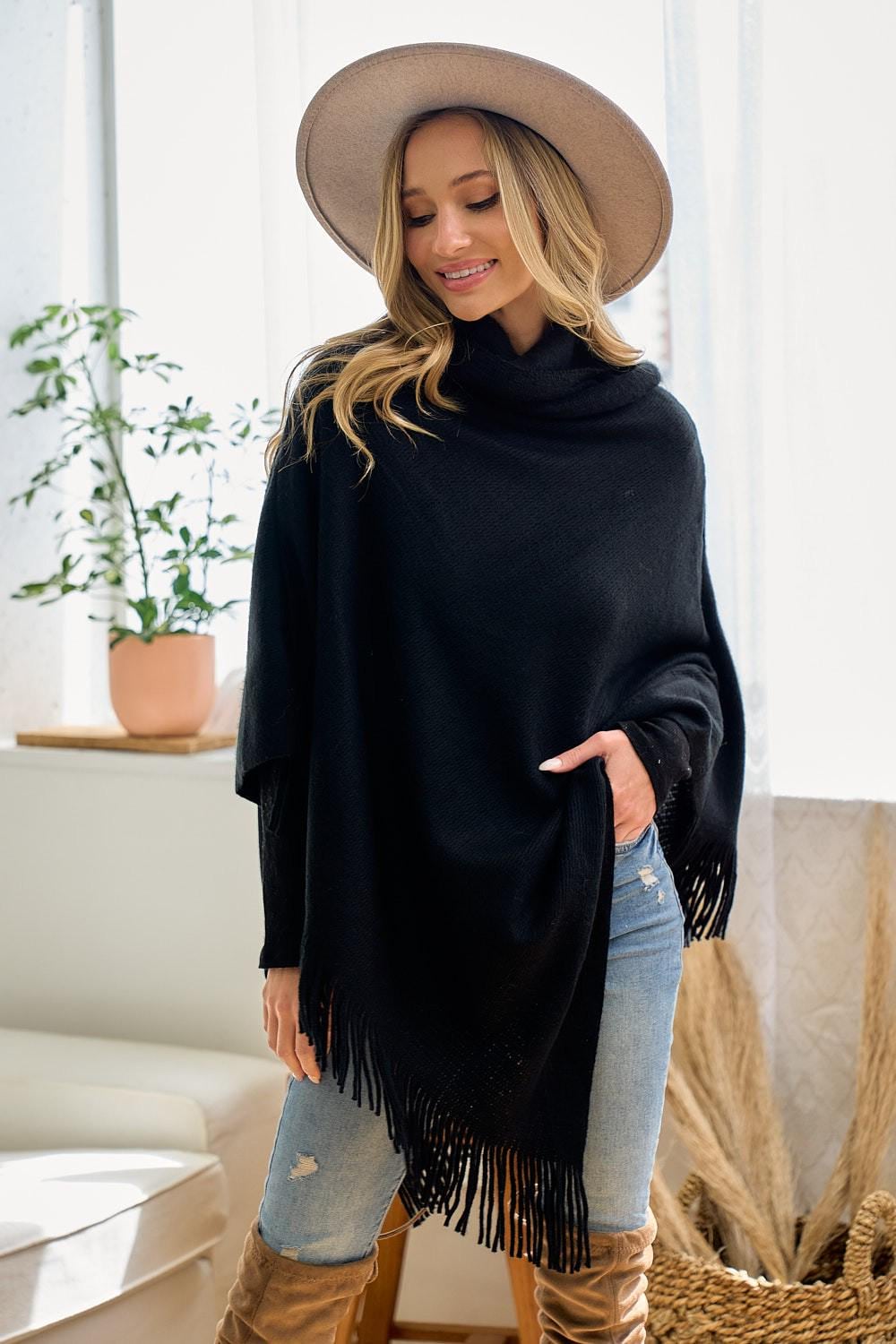 Sophisticated oversized cowl neck detail on a minimalist black knit layer for transitional styling