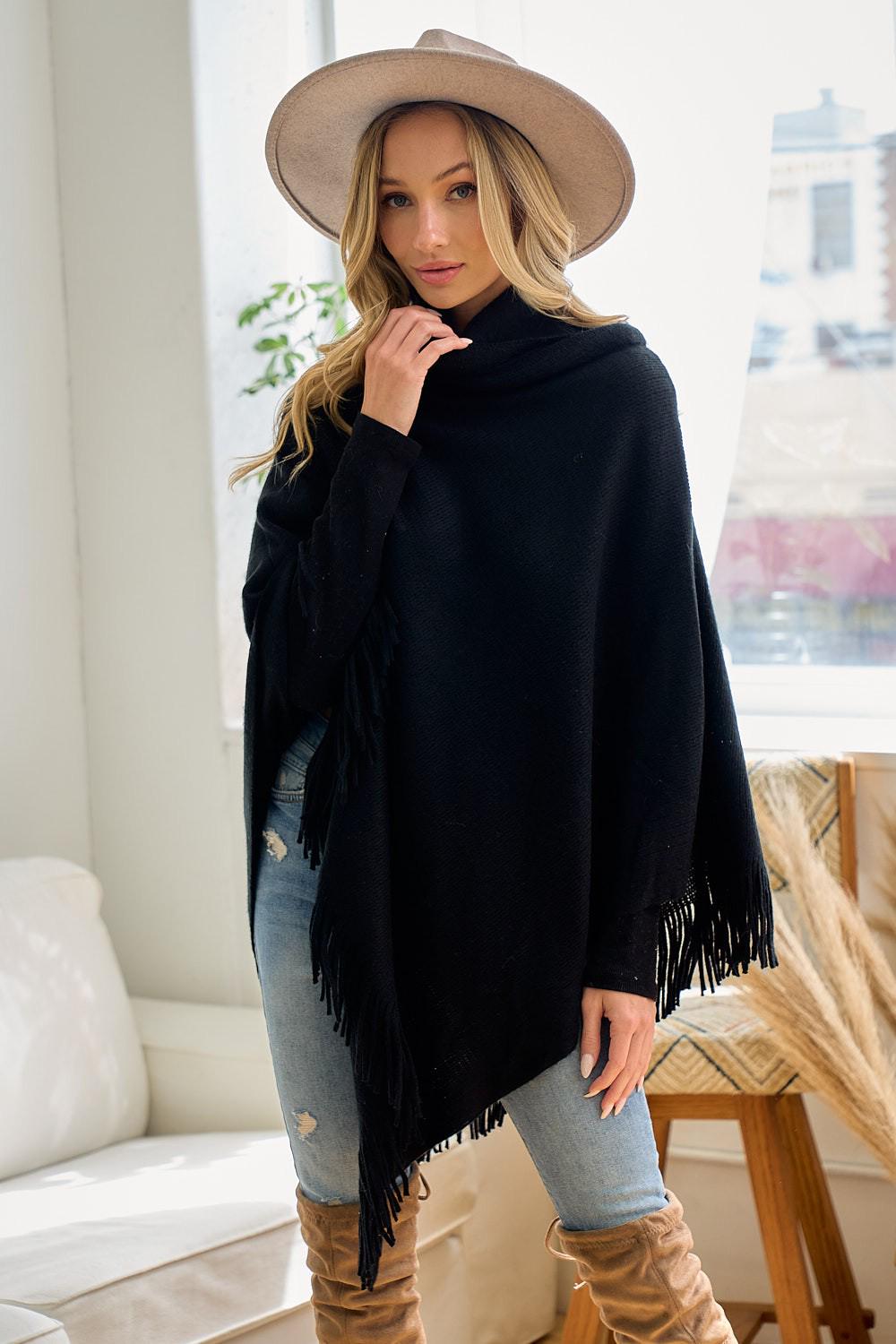 Macro shot of the breathable acrylic knit fabric used in this versatile black layering piece