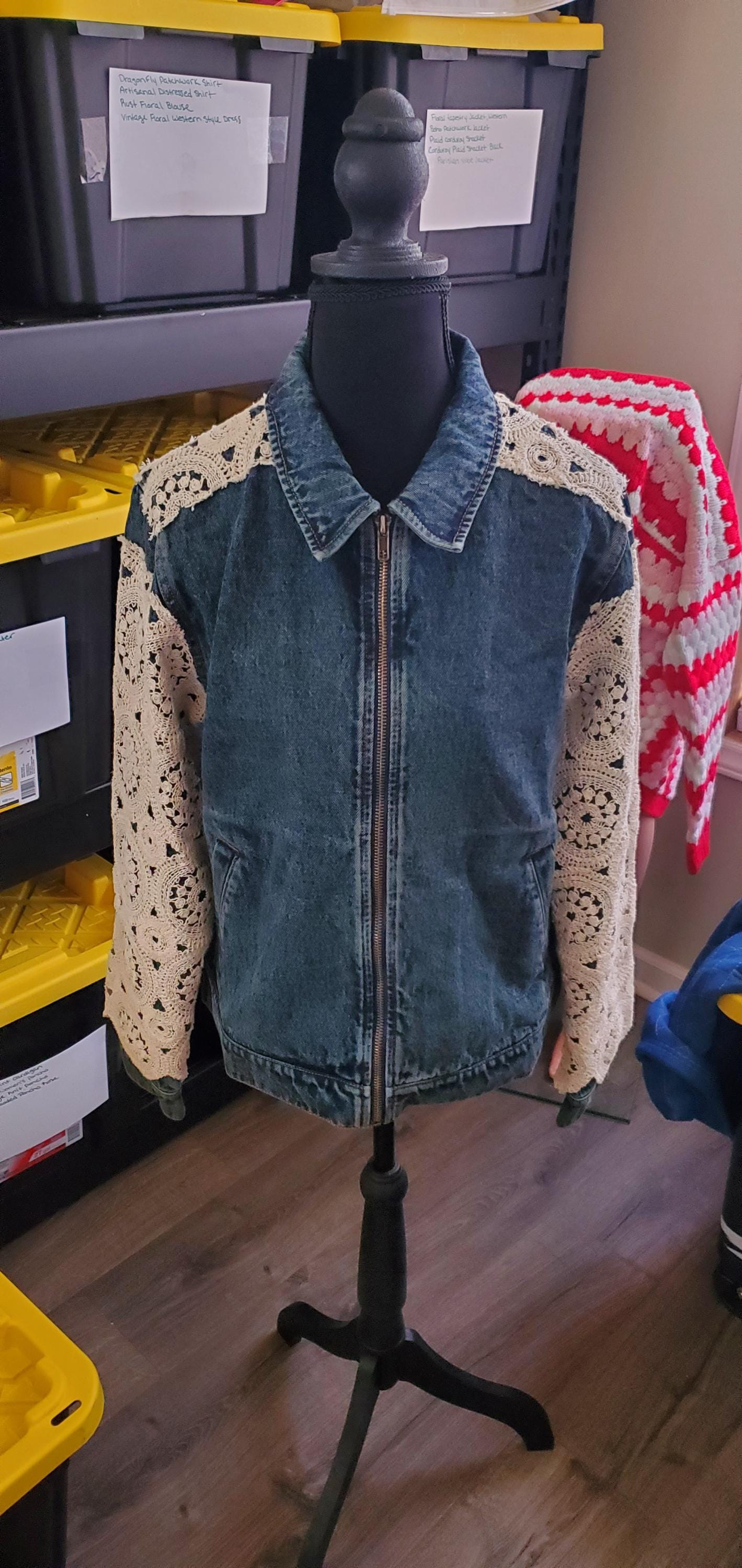 Vintage boho mid-wash blue denim zip jacket with cream floral crochet lace medallion sleeves and a classic collar.