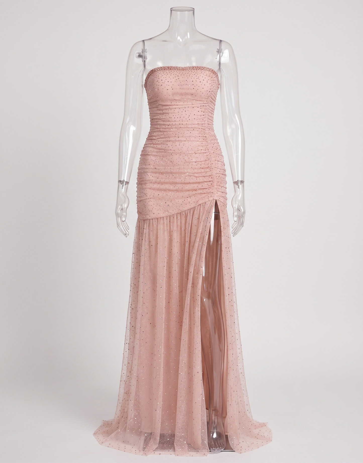 Model wearing the coquette style pink strapless gown with sparkling rhinestones for a black-tie gala event.