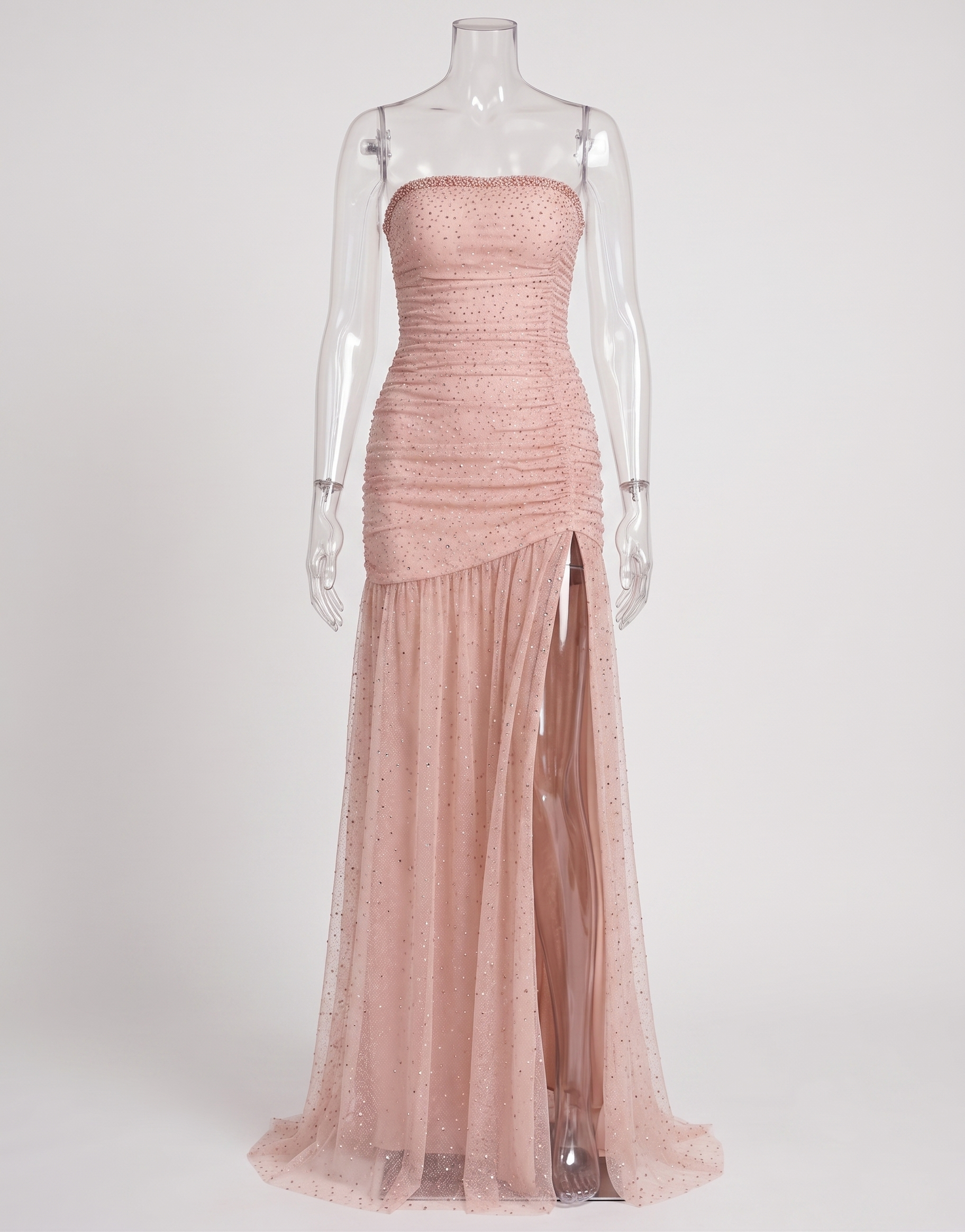 Model wearing the coquette style pink strapless gown with sparkling rhinestones for a black-tie gala event.