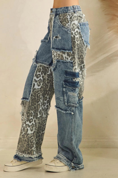 High-waisted fit of distressed cotton jeans with Y2K-inspired leopard print patchwork