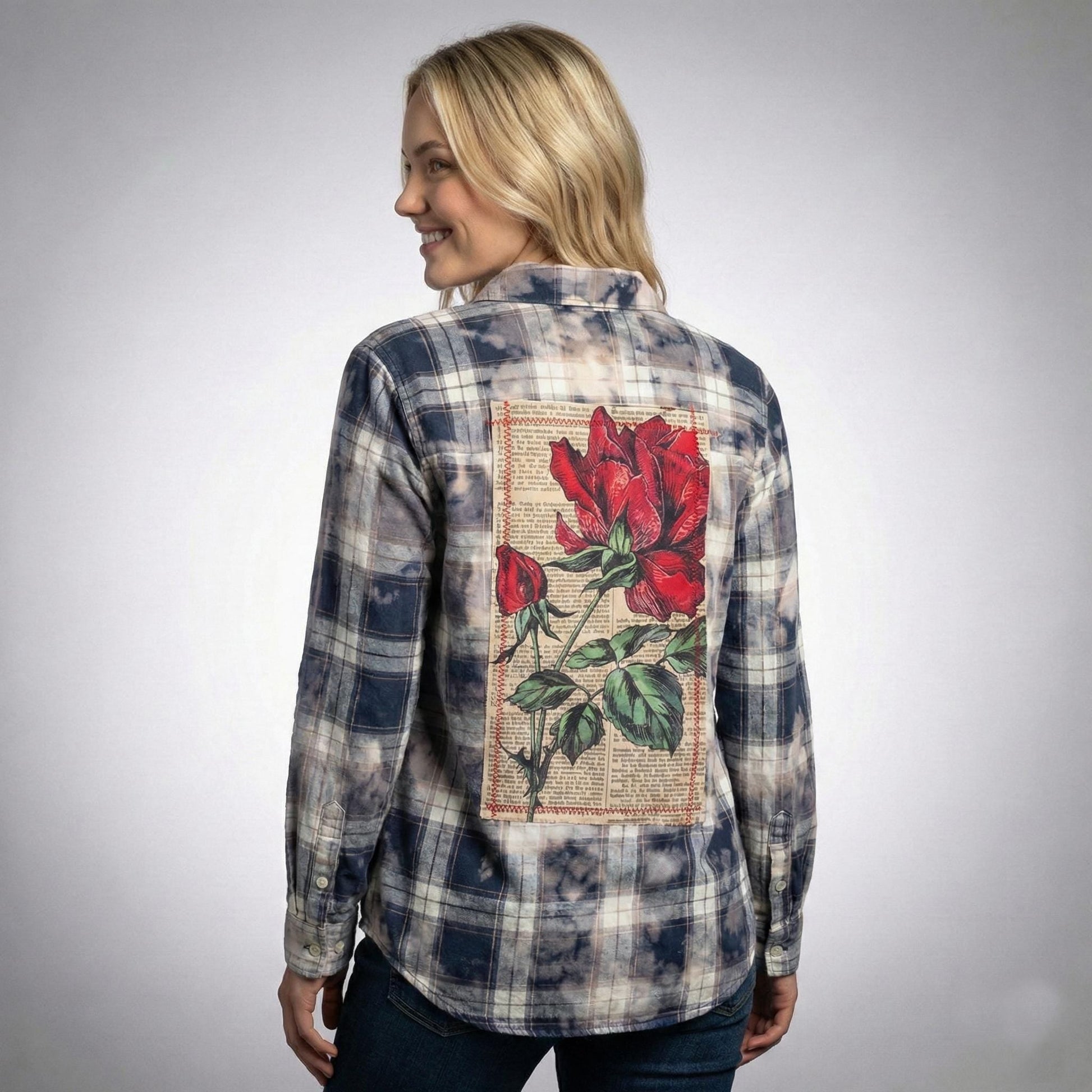 Back view of the Whimsigoth flannel shirt showing a vintage red rose back patch and acid-wash finish.