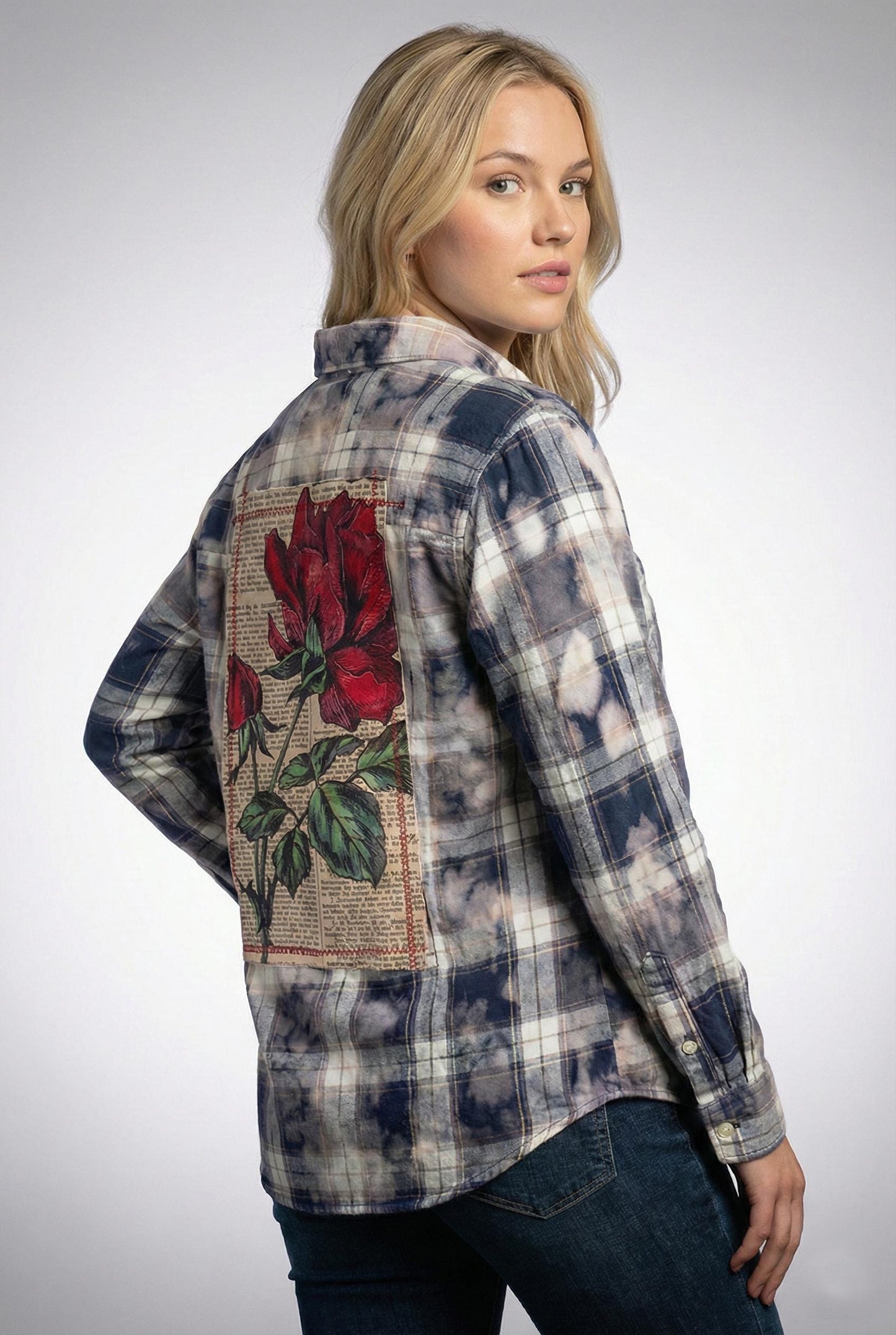 Side profile of this whimsigoth button down highlighting the raw frayed hem and relaxed cotton blend drape.