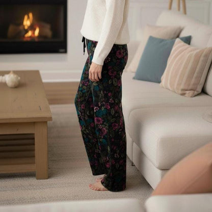 Close-up of the premium plush fleece material on these dark academia floral trousers showing velvet-like texture