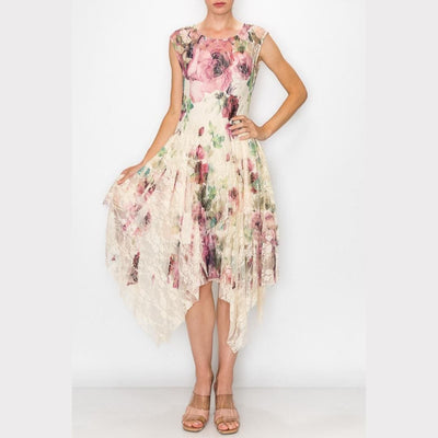 Front view of the cream floral lace midi dress featuring a vibrant botanical print and asymmetrical handkerchief hem.