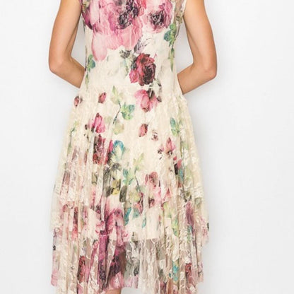 Side angle of the ethereal lace dress demonstrating the graceful movement of the uneven handkerchief hemline.