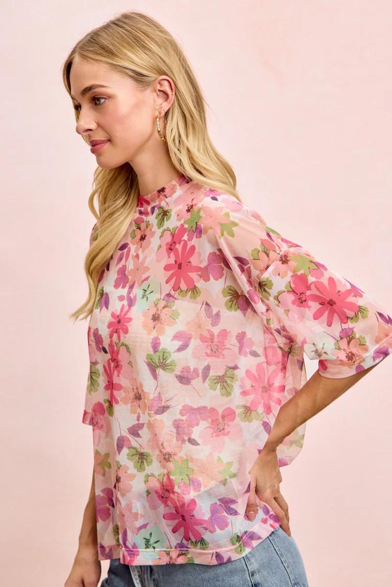 Lifestyle shot of a woman in the sheer botanical tee, styled for a romantic Cottagecore aesthetic outing