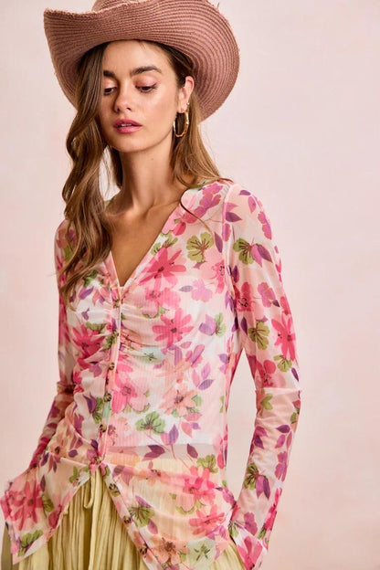 Back perspective of the translucent watercolor botanical print top showing the breathable mesh fabric