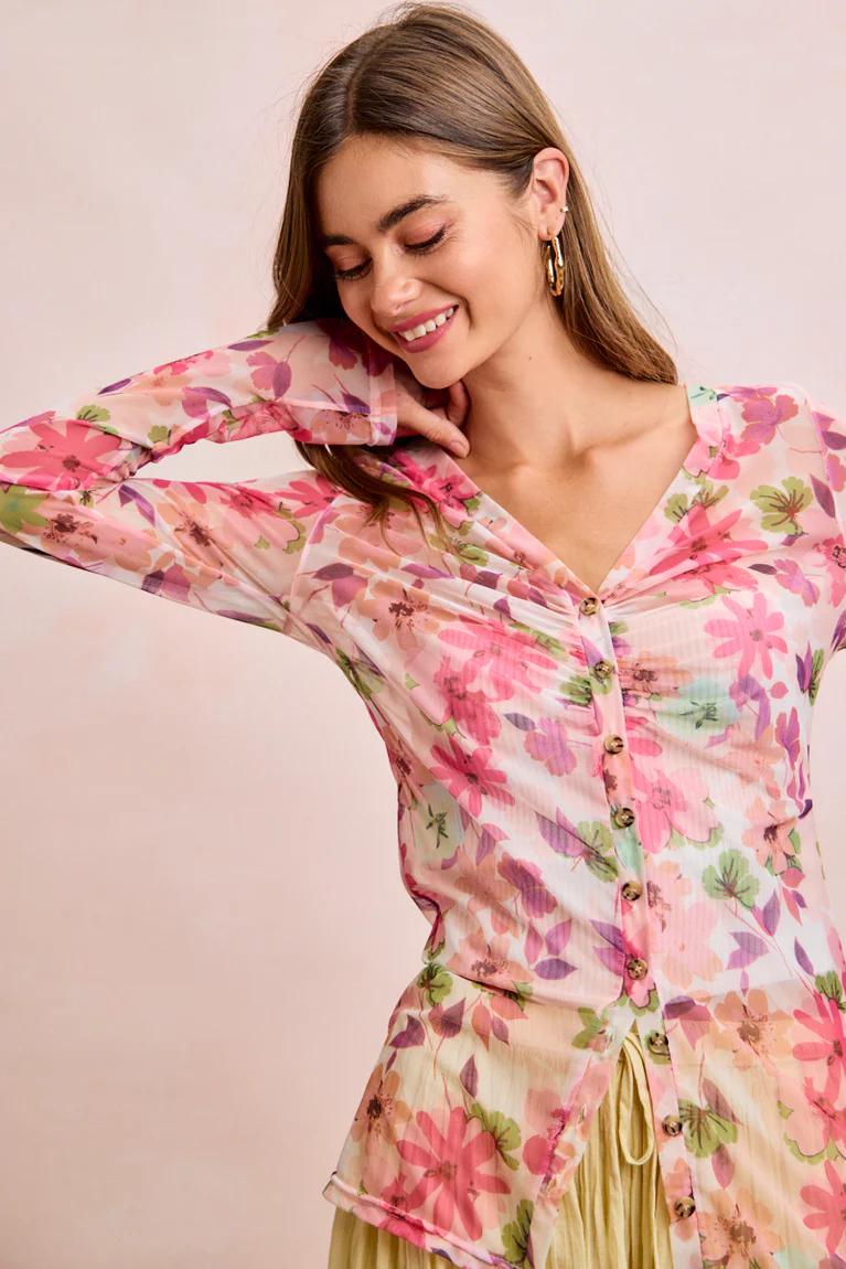 Side profile of the slim-fit ruched blouse highlighting the second skin translucent mesh silhouette