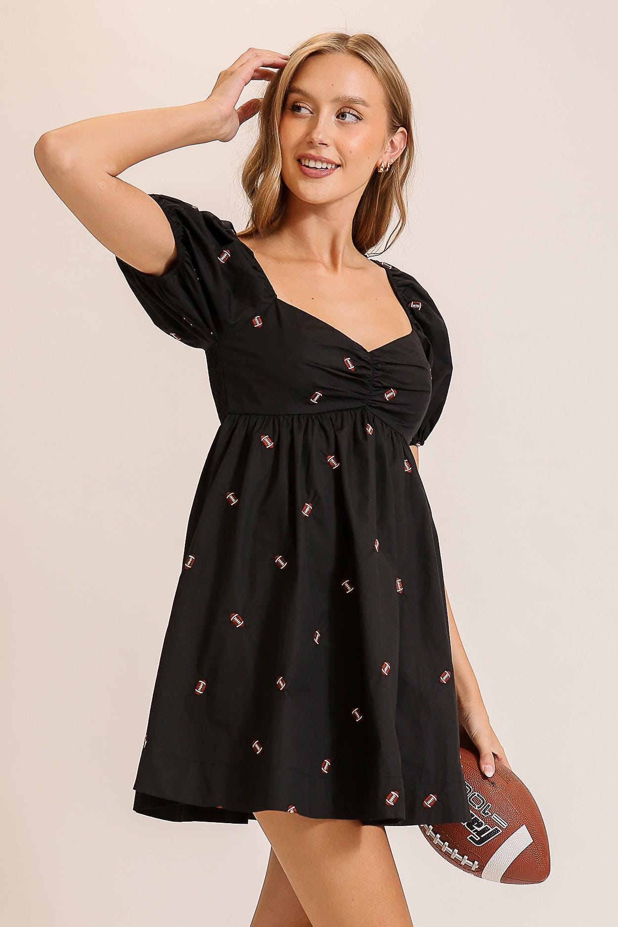 Side angle of the coquette sport babydoll dress featuring elasticized puff sleeves and a feminine silhouette