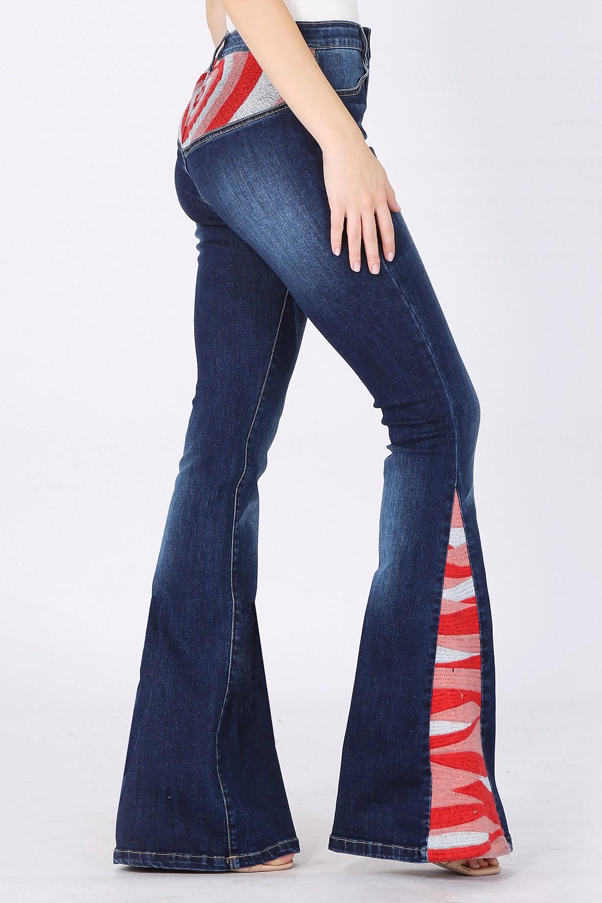 Side profile of western flare jeans featuring a 34 inch inseam and wide bell bottom leg openings