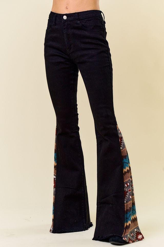 Side angle of retro 70s bell bottoms showing the 35-inch inseam and vibrant Southwestern hem detail