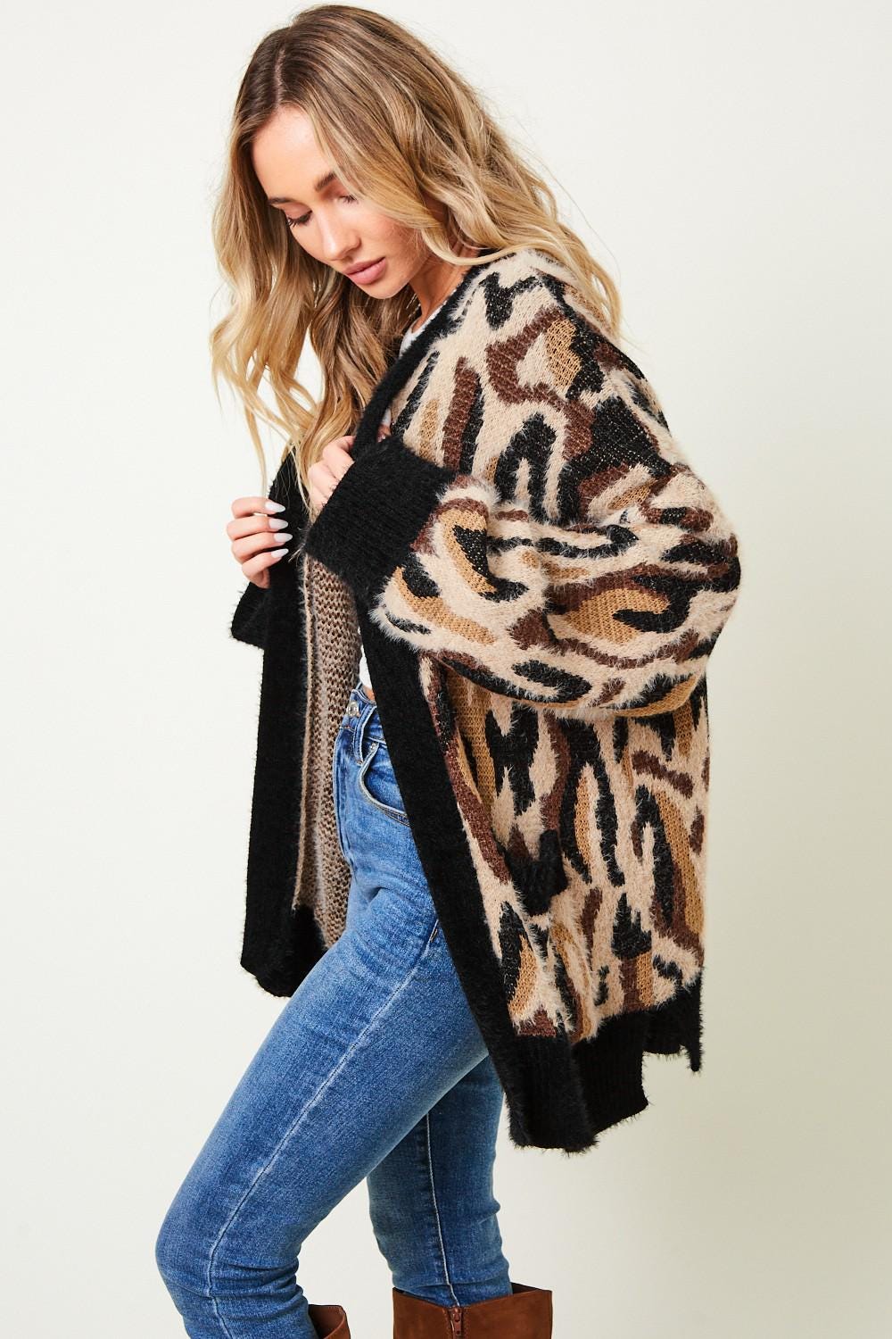 Open-front view of an animal print knit layer, showcasing its boho-chic and glam rock streetwear appeal.