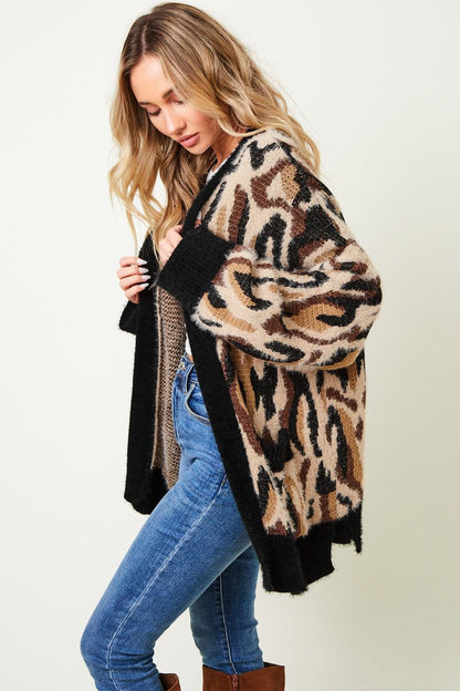 Open-front view of an animal print knit layer, showcasing its boho-chic and glam rock streetwear appeal.