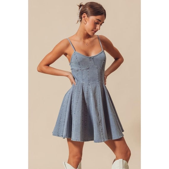 Full body shot of the spaghetti strap chambray dress showcasing the fit and flare silhouette