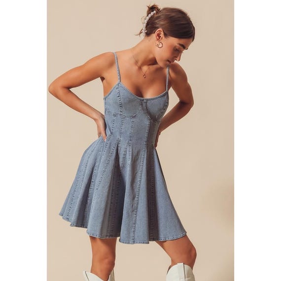 Detailed view of the adjustable spaghetti straps and sweetheart bustier top on the denim dress