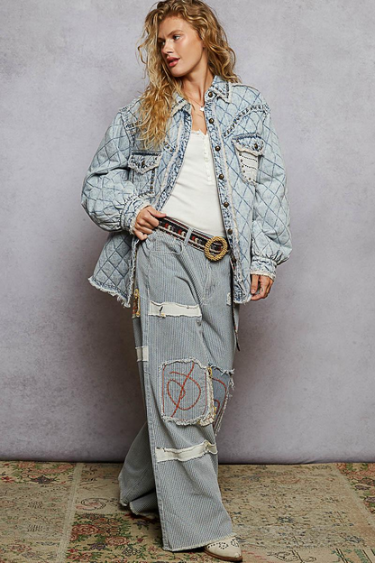 Lifestyle shot of a model wearing a relaxed fit padded denim jacket with feminine lace overlays