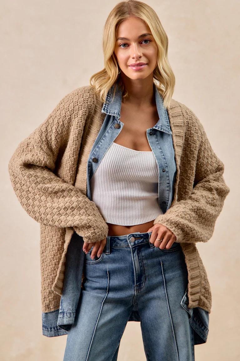 Front view of the oversized waffle knit cardigan with light wash denim patchwork details