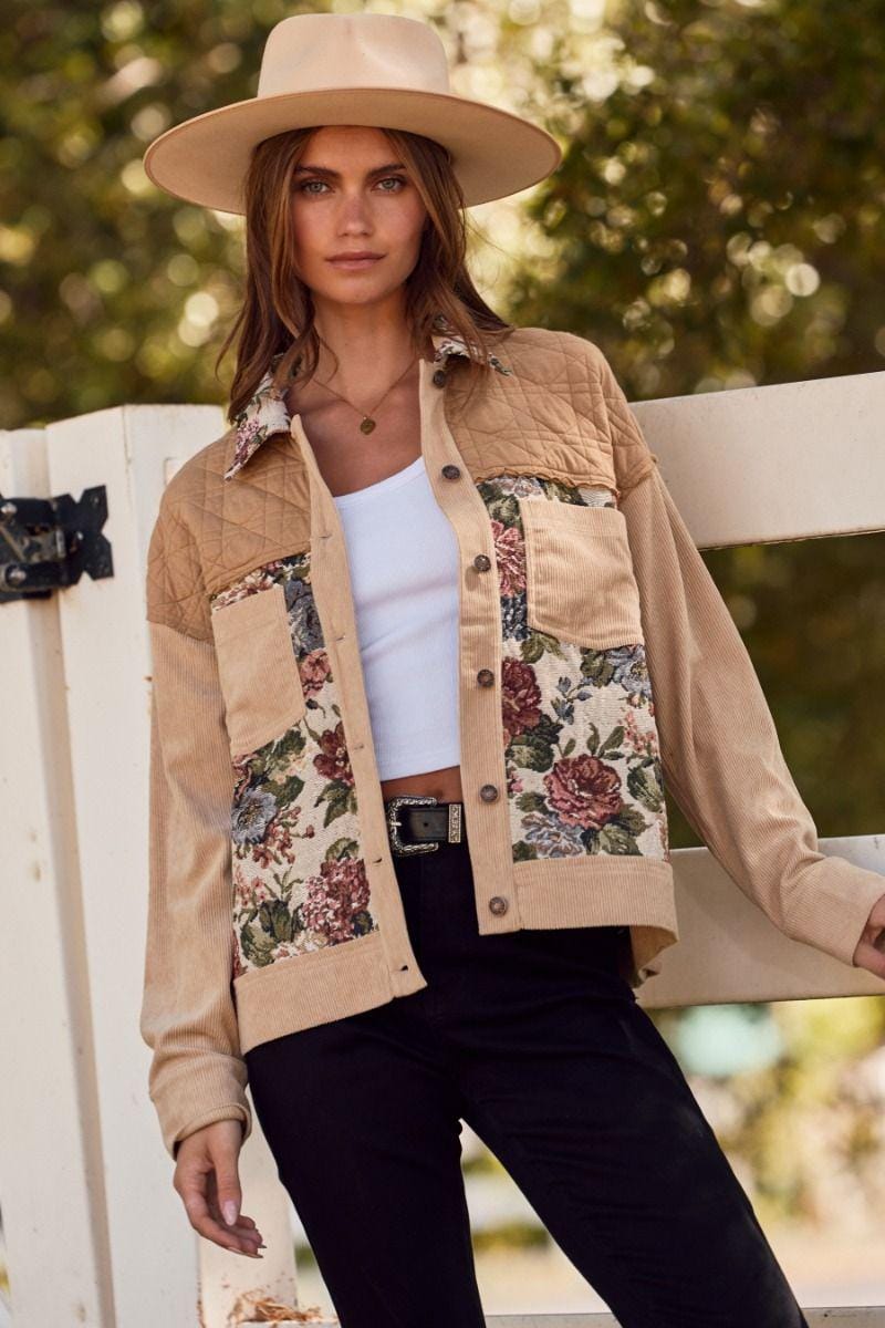 Back view of the cottagecore corduroy jacket featuring vintage-inspired floral jacquard and structured tan fabric