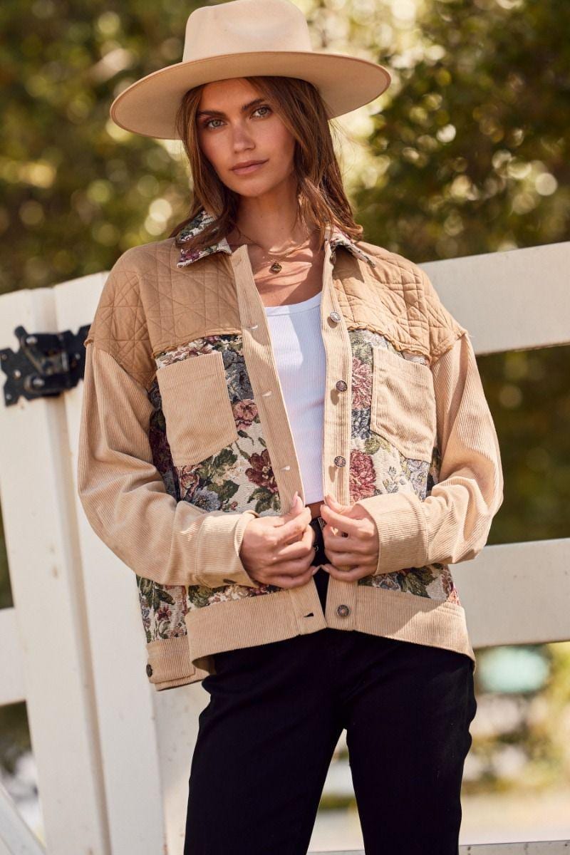 Close-up of intricate floral tapestry panels and quilted shoulder detail on the textured patchwork shacket