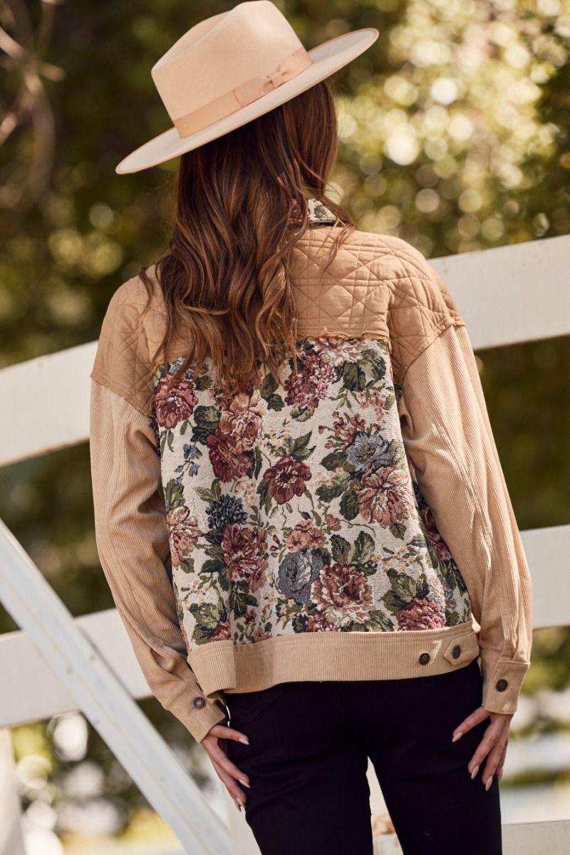 Side angle of the heavy-weight tan corduroy jacket highlighting the durable drape and multicolor floral accents
