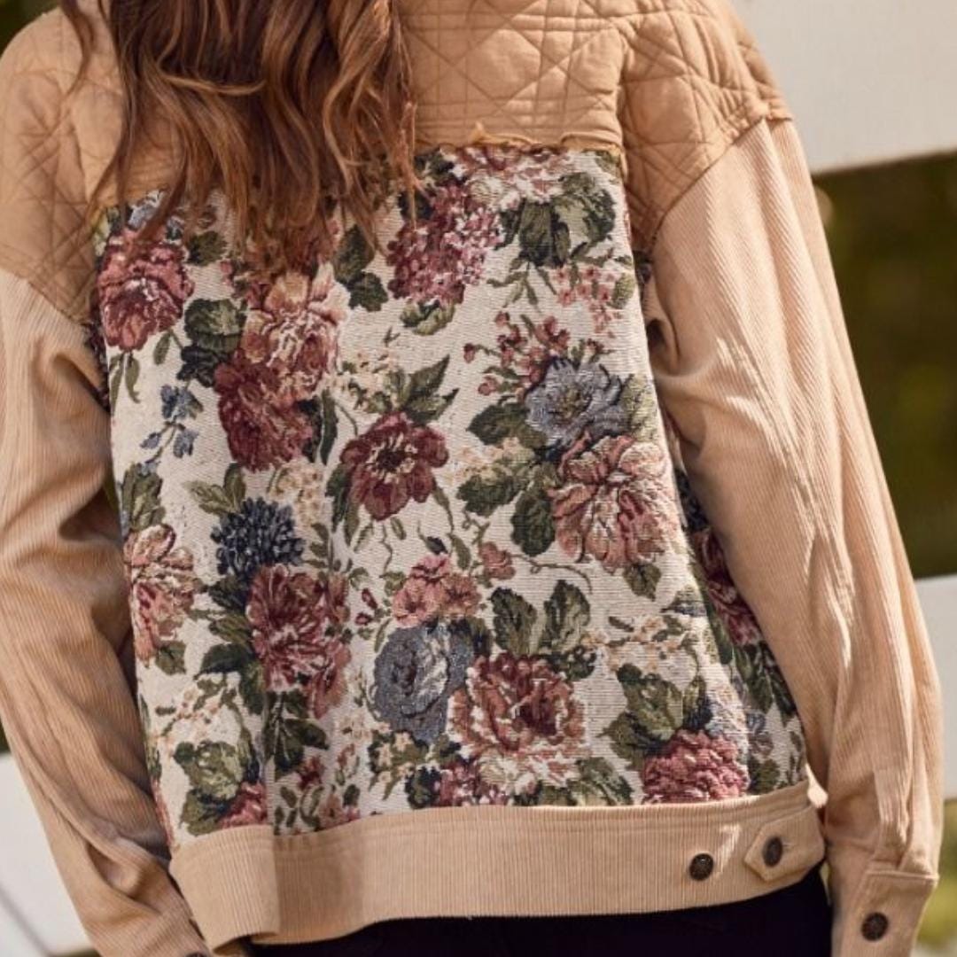 Detail shot of the cuff and button closure on this vintage tapestry jacket for women with rustic utility style