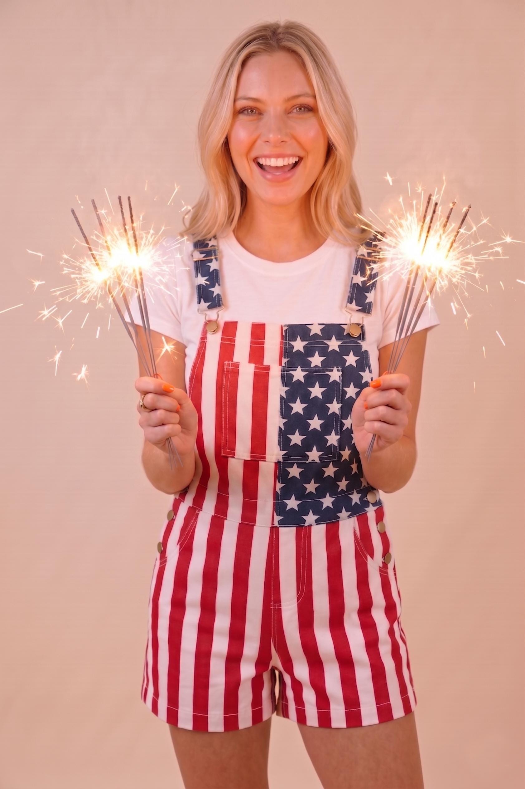 Side angle of Americana style shortalls showcasing the navy blue star pattern and red vertical stripe design