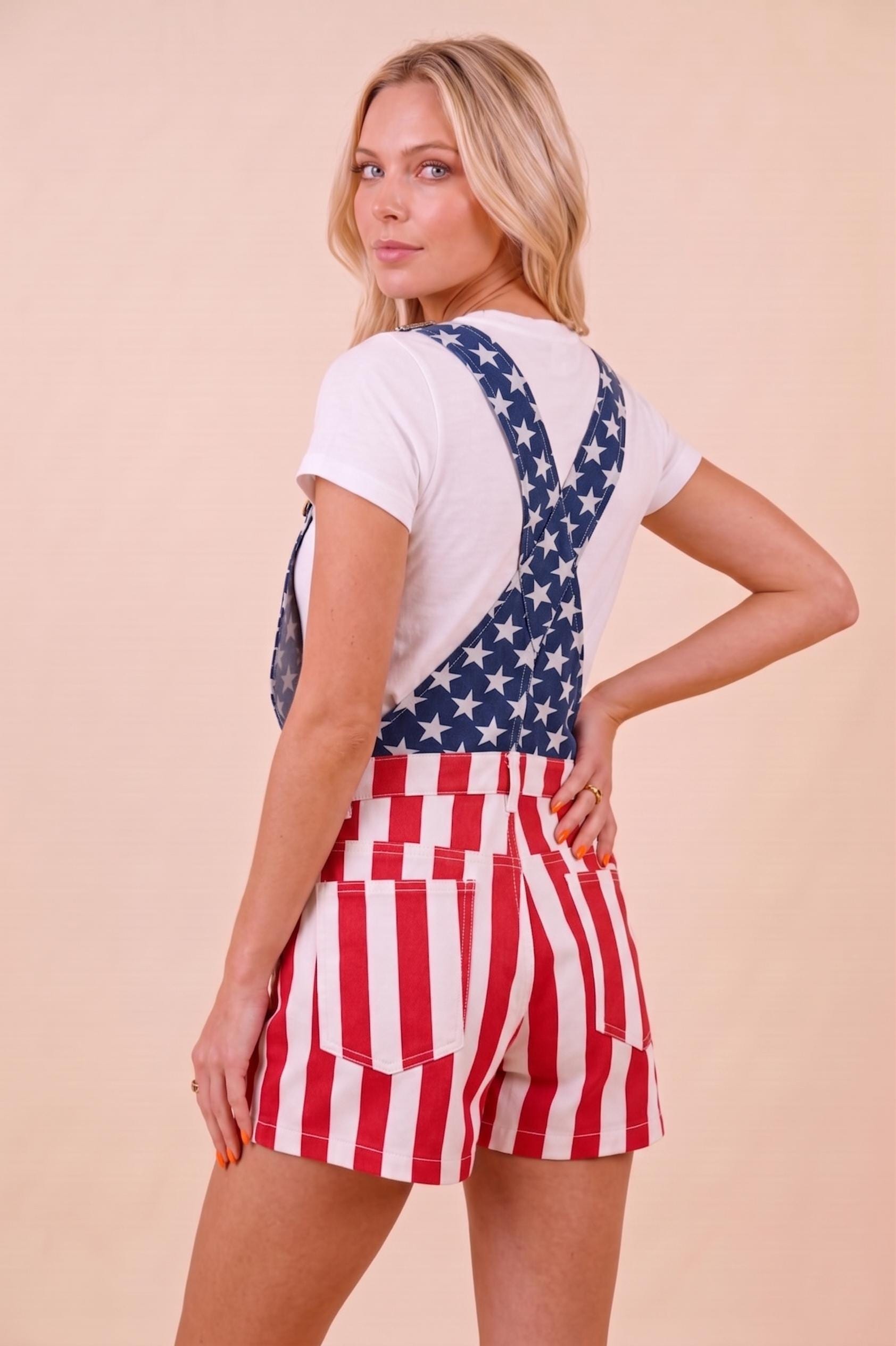 Detail of the adjustable shoulder straps and durable hardware on these vintage-inspired patriotic overalls