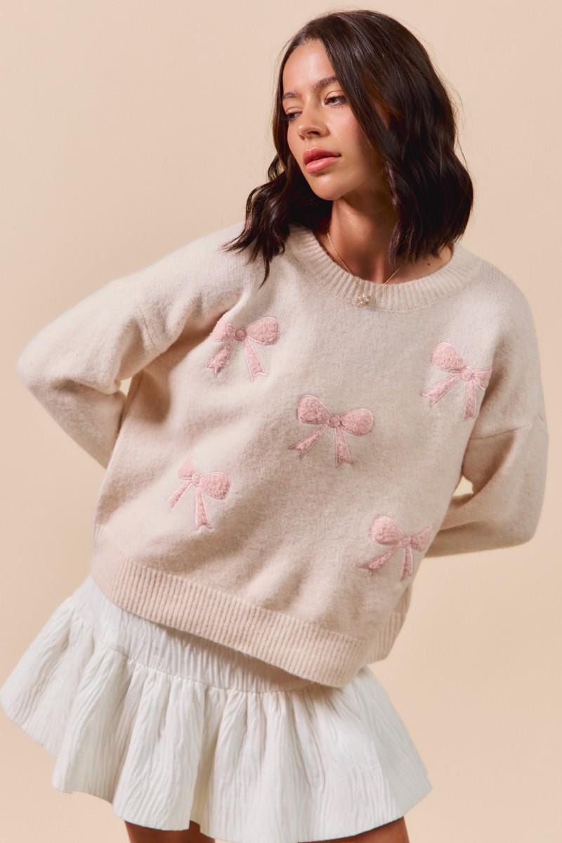 Front view of the Pink Bow Embroidered Knit Pullover in cream for a soft girl coquette aesthetic