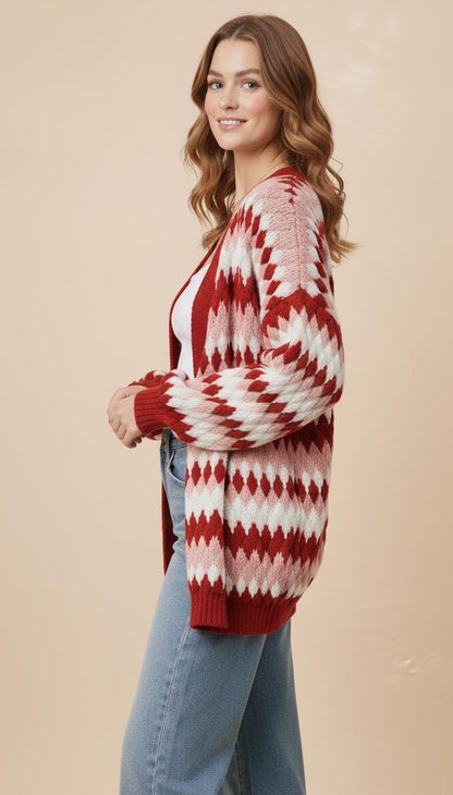 Back of the eclectic grandpa style sweater showing the continuous vibrant geometric pattern in white and red