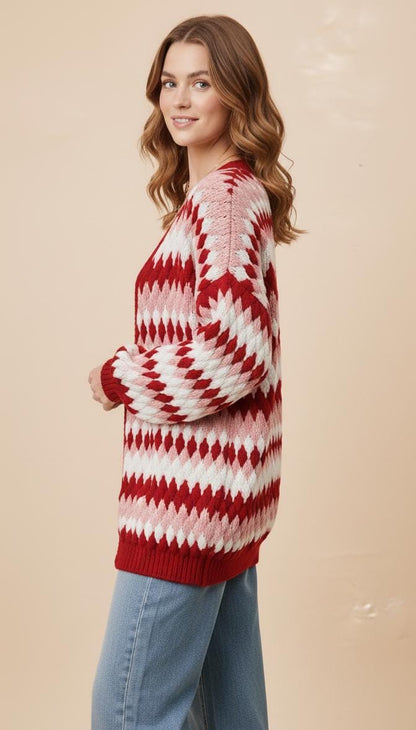 Side angle of the Whimsigoth aesthetic diamond knit sweater showcasing the thick ribbed cuffs and vibrant tones