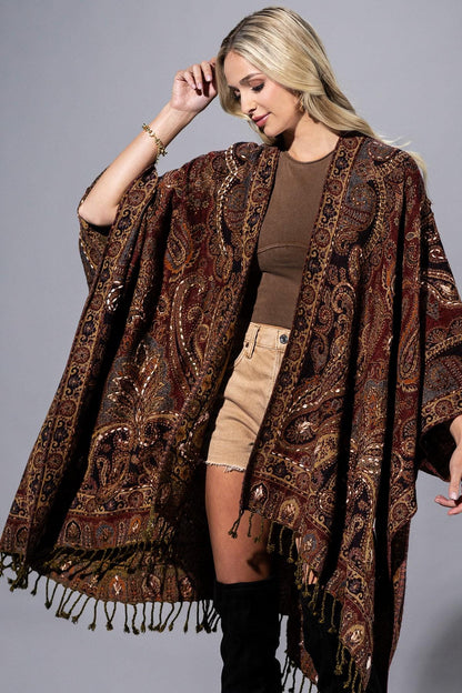 Back view of an oversized 100% wool wrap showing the intricate artisanal tapestry design
